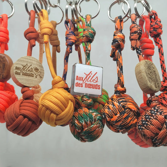 porte clés pomme de touline personnalisable paracord 550 orange fabrication artisanale Origine Corrèze gravure laser doming aux fils des nœuds