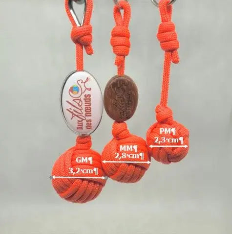 porte clés pomme de touline personnalisable paracord 550 orange fabrication artisanale Origine Corrèze gravure laser doming aux fils des nœuds taille