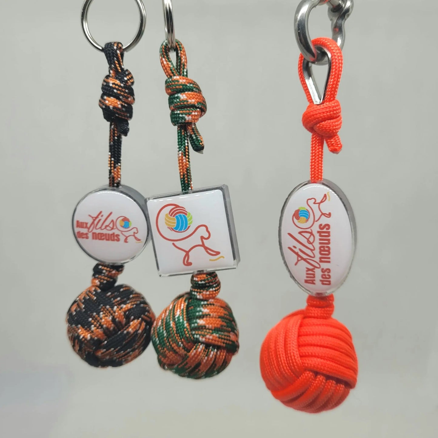 porte clés pomme de touline personnalisable paracord 550 orange fabrication artisanale Origine Corrèze gravure laser doming aux fils des nœuds