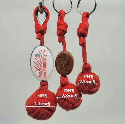 porte clés pomme de touline personnalisable paracord 550 rouge fabrication artisanale Origine Corrèze gravure laser doming aux fils des nœuds taille