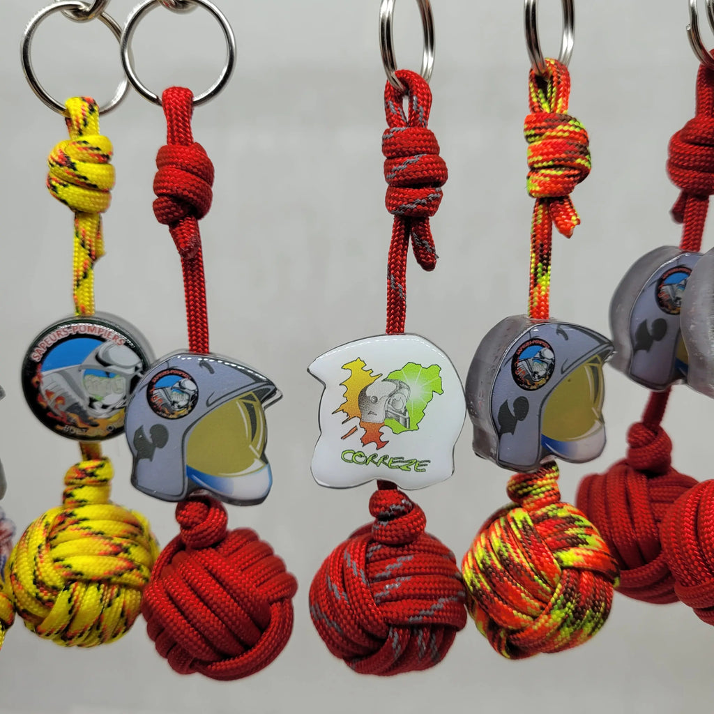 Porte-Clés Poing De  Singe P550 Les Sapeurs-Pompiers Aux fils des Noeuds
